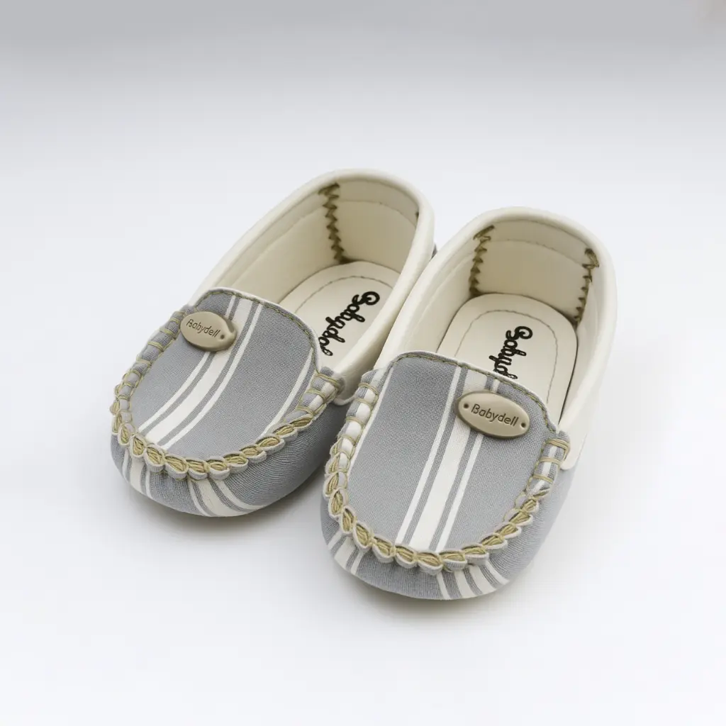 20251118_1016_Baby Shoes Studio Display_remix_01kab0g3eteha9p4ftrghfmeew.webp
