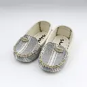 20251118_1016_Baby Shoes Studio Display_remix_01kab0g3eteha9p4ftrghfmeew.webp